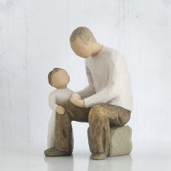 Father and little boy figurine sitting holding hands