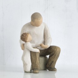 Father and little boy figurine sitting holding hands