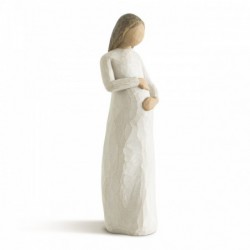 Woman holding belly figurine