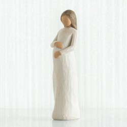 Woman holding belly figurine