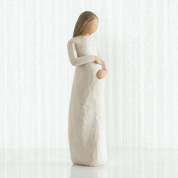 Woman holding belly figurine