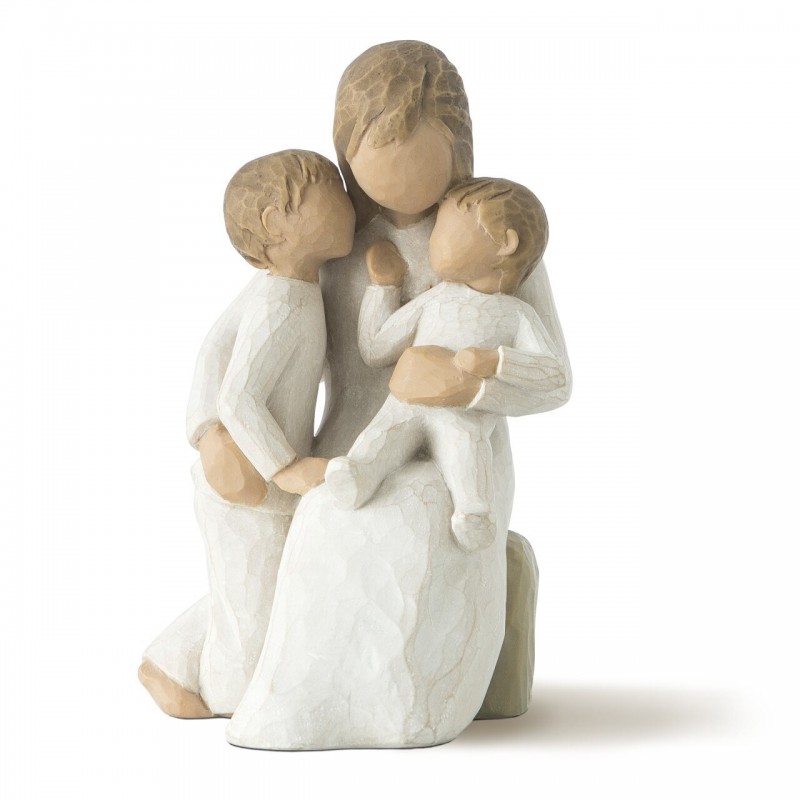 Mother figurine with arms wrapped around two children