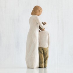 Woman figurine holding boy