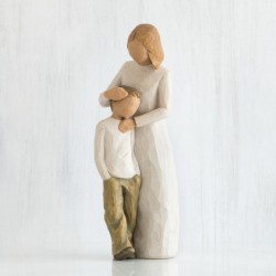 Woman figurine holding boy