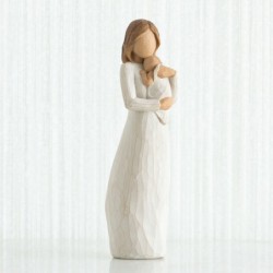 Woman holding baby figurine