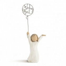 Front view of little girl with brown hair and both arms in the air as she holds a wire balloon. Text on balloon is wire