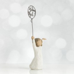 Front view of little girl with brown hair and both arms in the air as she holds a wire balloon. Text on balloon is wire