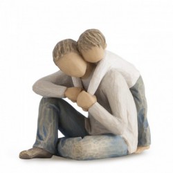 Father figurine sitting down hugging boy figurine from behind - both are wearing blue jeans and white shirts