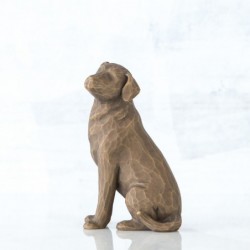 Brown dog figurine sitting turning to the side