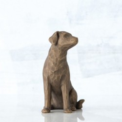 Brown dog figurine sitting turning to the side