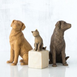 Brown dog figurine sitting turning to the side