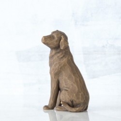Brown dog figurine sitting turning to the side