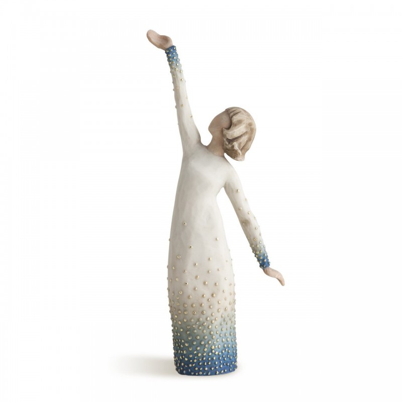 Woman figurine holding both her hands in different directions in white dress with blue on it embellished with crystals