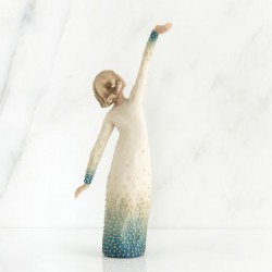 Woman figurine holding both her hands in different directions in white dress with blue on it embellished with crystals