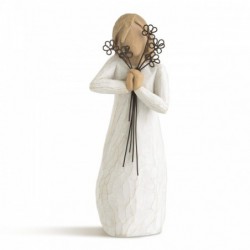 Woman figurine holding black flowers to her face