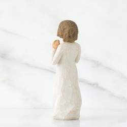 Woman figurine holding gold chain
