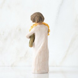 Front view of little girl with short brown hair holding a large bouquet of yellow roses