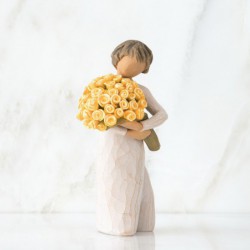 Front view of little girl with short brown hair holding a large bouquet of yellow roses