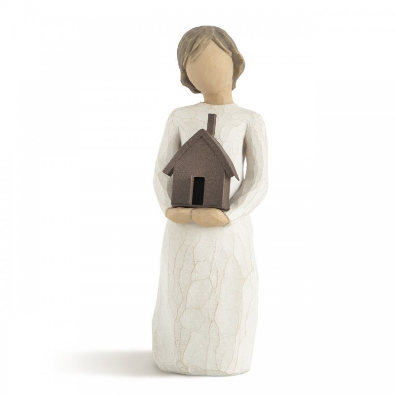 Little girl figurine holding brown bird house