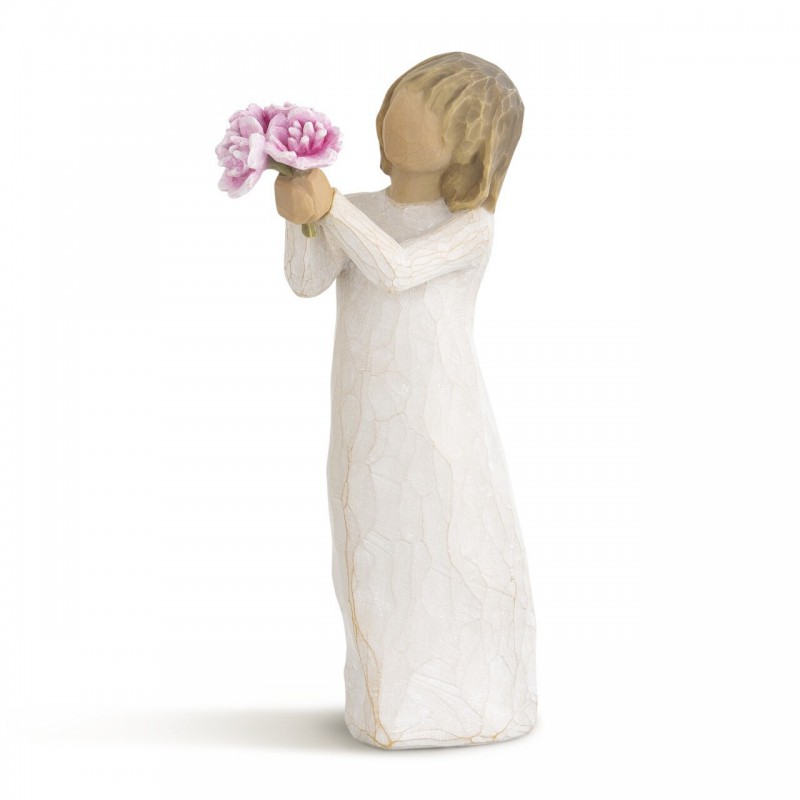 Front side view of girl with light brown hair holding out pink flowers with both hands