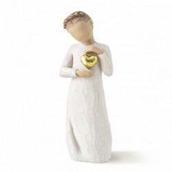 Young girl figurine holding gold heart