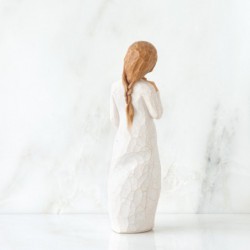 Little girl figurine holding star headband