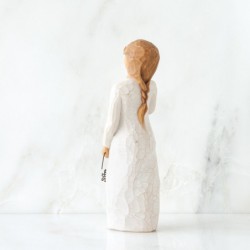 Little girl figurine holding star headband