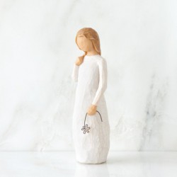 Little girl figurine holding star headband