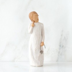 Little girl figurine holding star headband