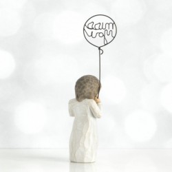 Small girl figurine holding 'miss you' balloon