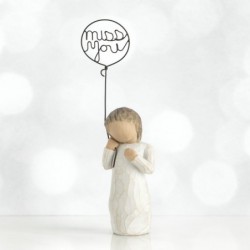 Small girl figurine holding 'miss you' balloon