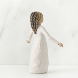 Brunette girl figurine in white dress with arms spread out