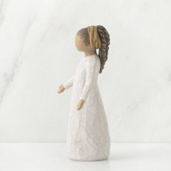 Brunette girl figurine in white dress with arms spread out