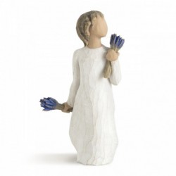 Brunette girl figurine in white dress holding two sets of blue flowers in each hand