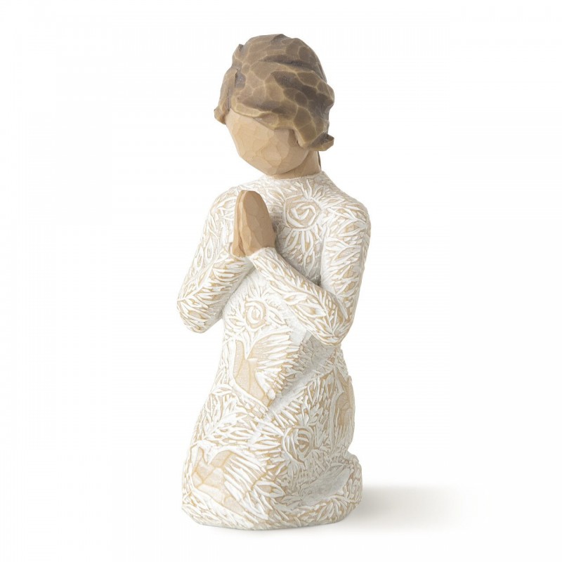 Young child figurine praying