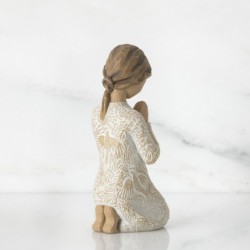 Young child figurine praying