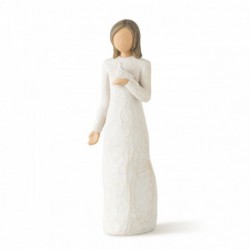 Brunette girl figurine in white dress holding white dove with one arm