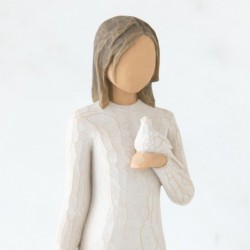 Brunette girl figurine in white dress holding white dove with one arm