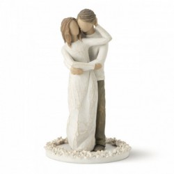 Woman figurine in white dress hugging man figurine - standing on white round plaque
