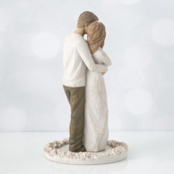 Woman figurine in white dress hugging man figurine - standing on white round plaque