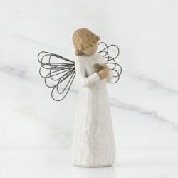 Angel figurine holding rock