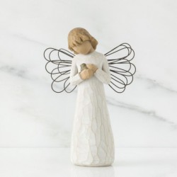Angel figurine holding rock