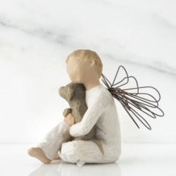 Close up of figurine angel holding puppy