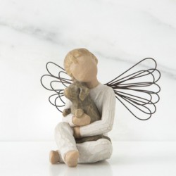 Close up of figurine angel holding puppy