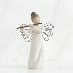 Close view of angel playing flue figurine