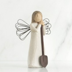 Angel figurine holding shovel