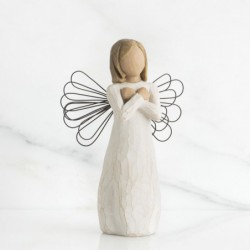 Angel figurine with arms crossed on her chest