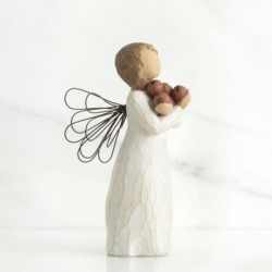 Angel figurine holding rocks