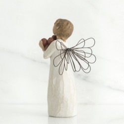 Angel figurine holding rocks