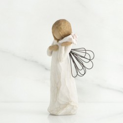 Small angel figurine holding phone to her ear